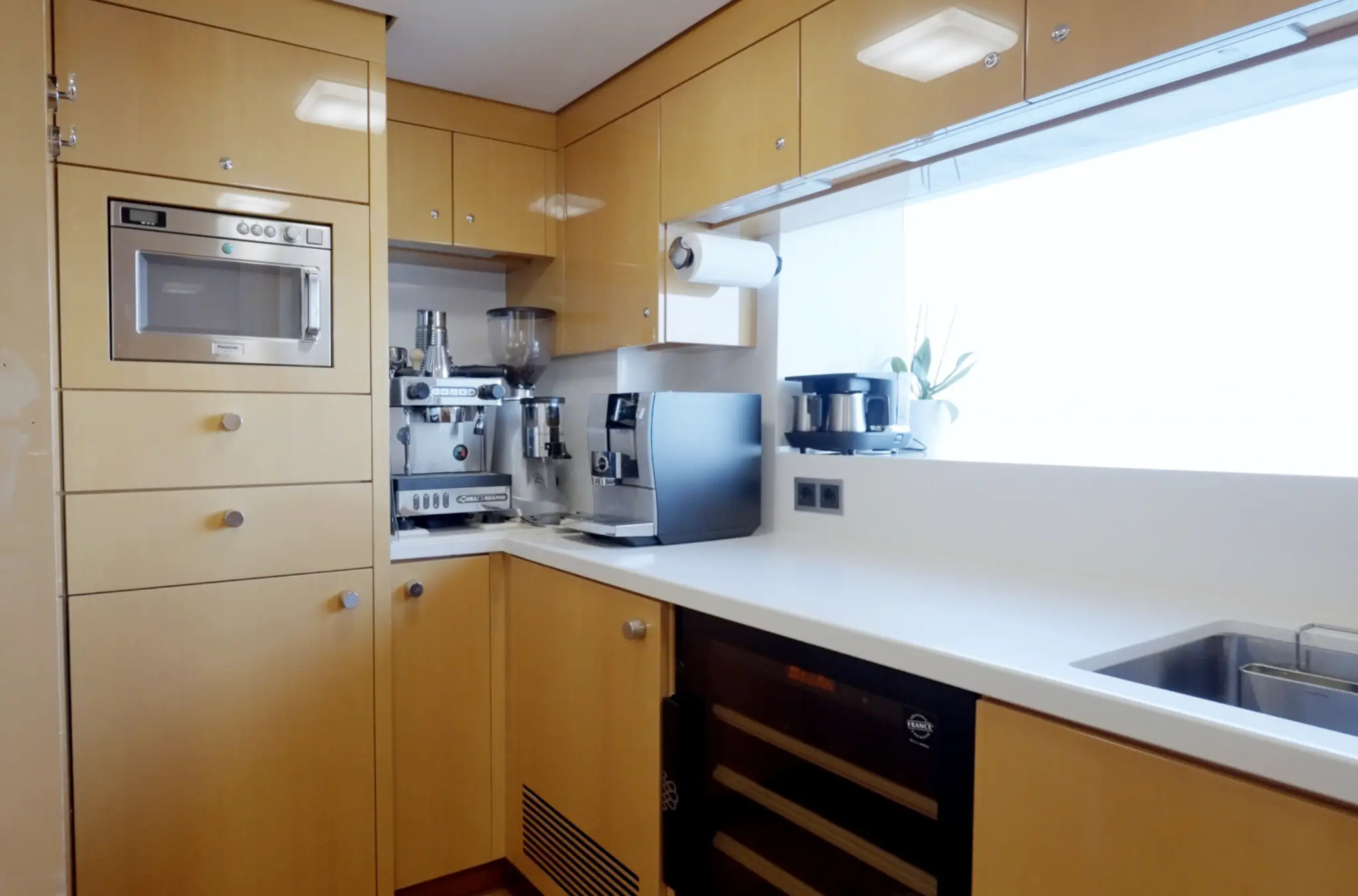 Crew pantry with espresso machine and modern appliances